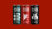 three cans of energy drink on a red background
